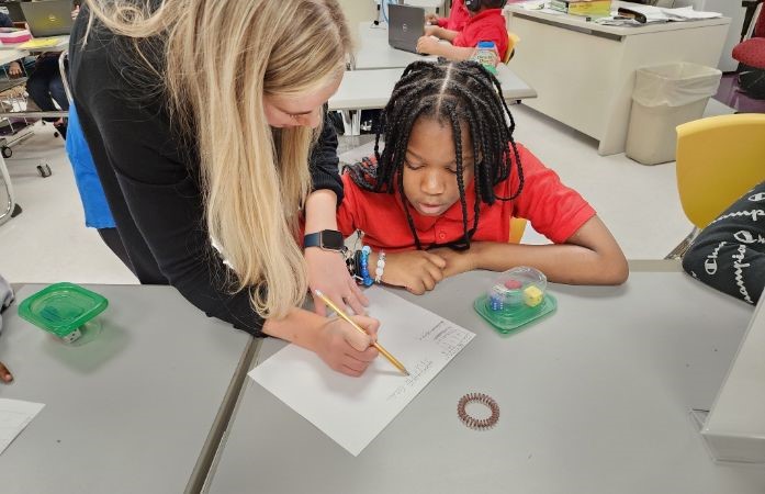  Borson working with a student